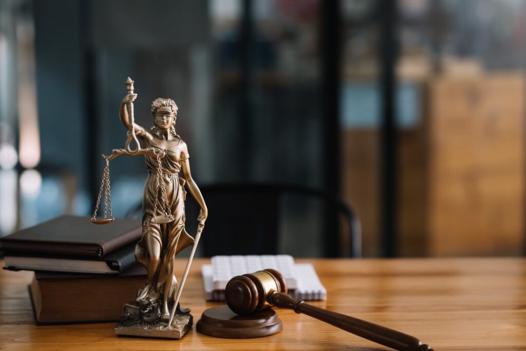 Statue of lady justice on desk of a lawyer.