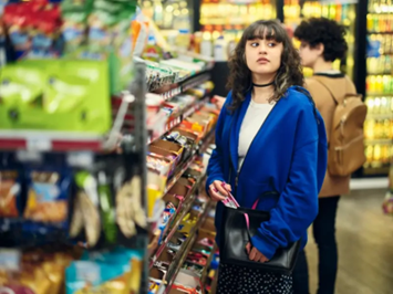 Two kids shoplifting some candy in a Texas gas station.