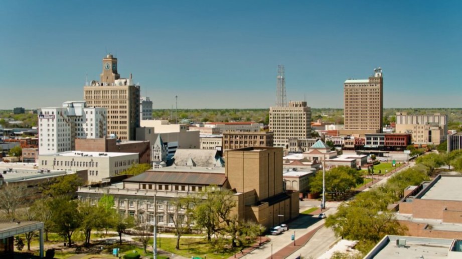Aerial view of downtown buildings and streets on a clear day in Beaumont, TX