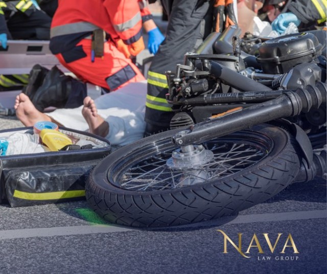 Nava Law Group image showing a motorcycle on the roadway after a crash