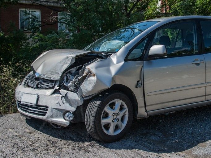 Damaged company vehicle after a car accident in Houston, TX